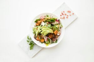 Eat More Plants - buddha bowl with avocado